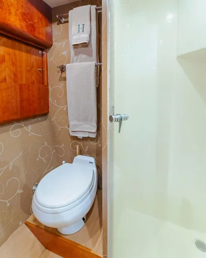 Wrangler Yacht Photos Pics Luxurious bathroom in 2008 Ocean Yachts 54 Super Sport with elegant wood accents and modern fixtures.