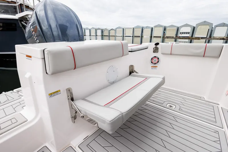  Yacht Photos Pics 2025 Solara S-250 Coupe boat interior with foldable seating and modern design.