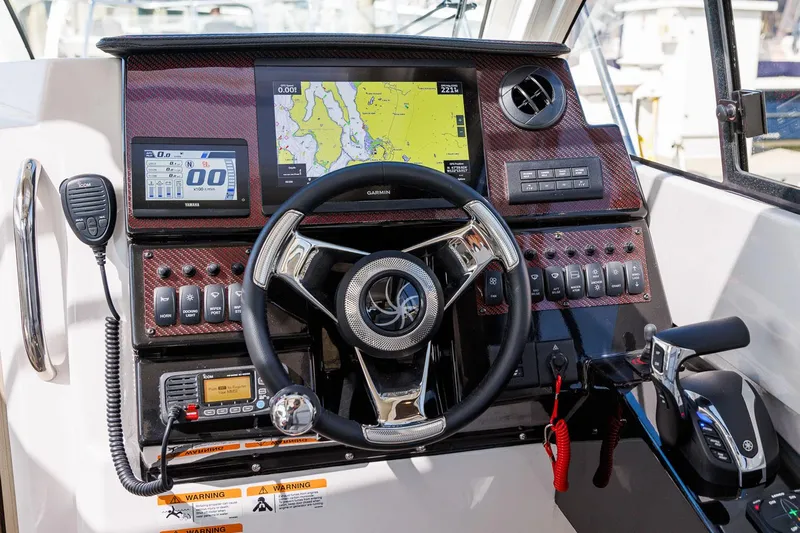  Yacht Photos Pics 2025 Solara S-250 Coupe dashboard with navigation and control systems.