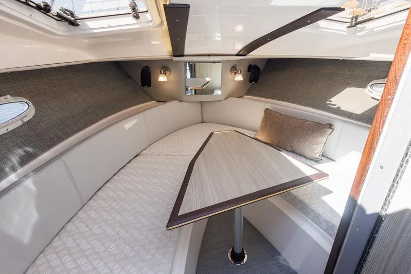  Yacht Photos Pics Luxurious interior of 2025 Solara S-250 Coupe with elegant seating and table.