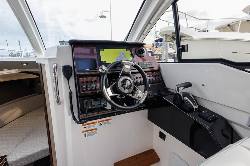  Yacht Photos Pics 2025 Solara S-250 Coupe cockpit with modern navigation and control systems.