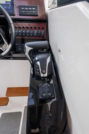  Yacht Photos Pics 2025 Solara S-250 Coupe interior dashboard with control panel and steering wheel.