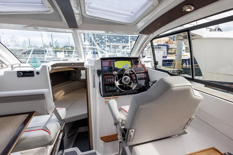  Yacht Photos Pics Interior of 2025 Solara S-250 Coupe, featuring modern helm and seating.