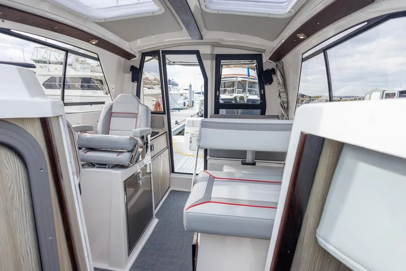  Yacht Photos Pics Interior of 2025 Solara S-250 Coupe boat, featuring modern seating and sleek design.