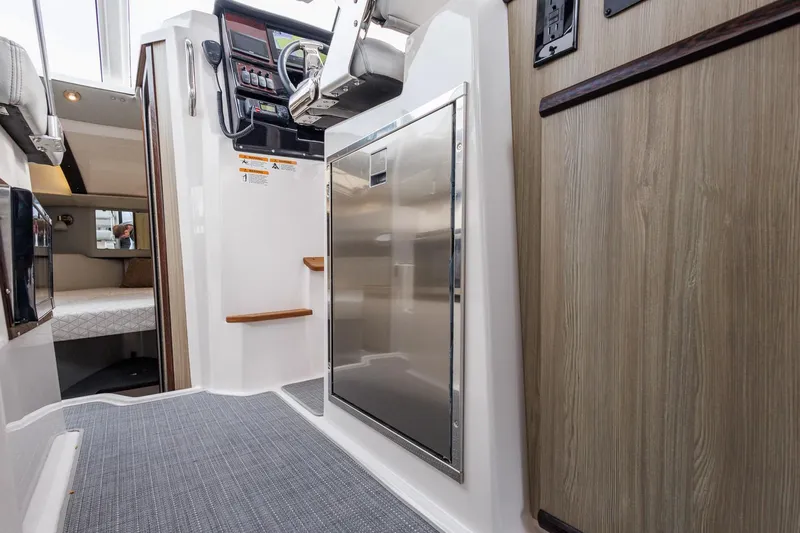  Yacht Photos Pics Interior of 2025 Solara S-250 Coupe, featuring modern design and wood accents.