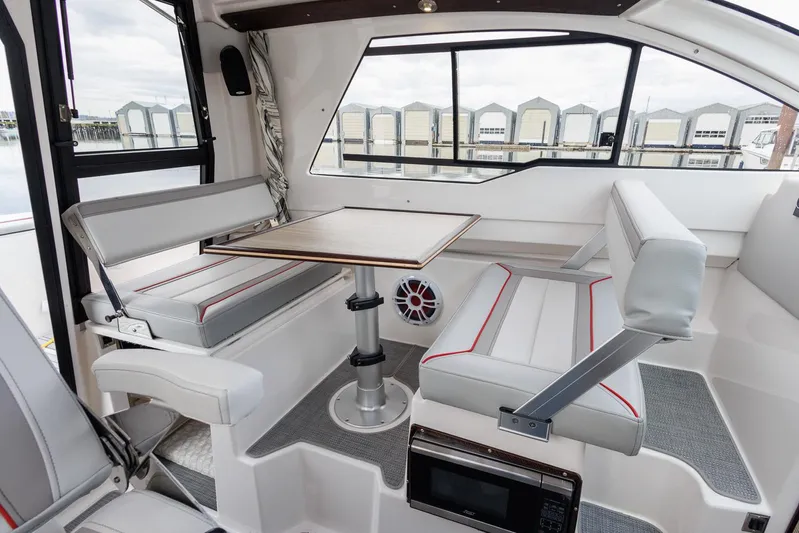  Yacht Photos Pics Interior of 2025 Solara S-250 Coupe with modern seating and table.
