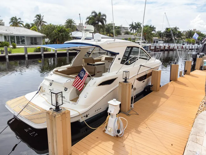  Yacht Photos Pics 2019 Sea Ray Sundancer 350 Coupe docked by waterfront homes.