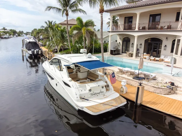  Yacht Photos Pics 2019 Sea Ray Sundancer 350 Coupe docked by luxury waterfront home.