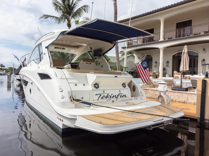  Yacht Photos Pics 2019 Sea Ray Sundancer 350 Coupe docked by a luxurious waterfront home.