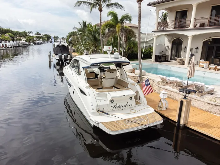  Yacht Photos Pics 2019 Sea Ray Sundancer 350 Coupe docked by luxurious waterfront home.