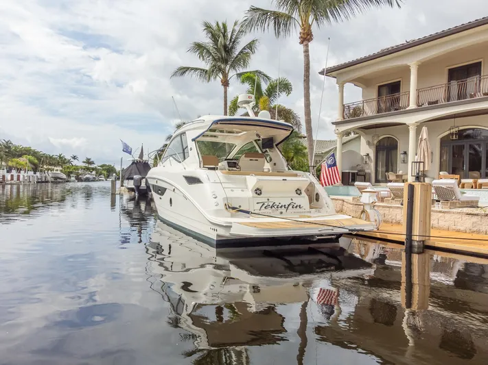  Yacht Photos Pics 2019 Sea Ray Sundancer 350 Coupe docked by a luxurious waterfront home.