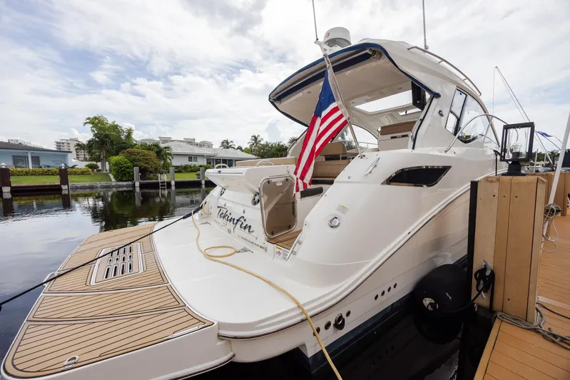  Yacht Photos Pics 2019 Sea Ray Sundancer 350 Coupe docked with American flag, rear view.
