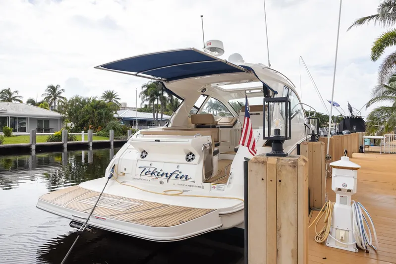  Yacht Photos Pics 2019 Sea Ray Sundancer 350 Coupe docked by a waterfront home.