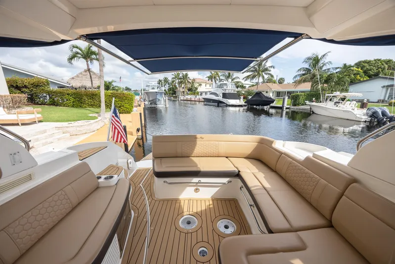  Yacht Photos Pics Luxurious 2019 Sea Ray Sundancer 350 Coupe with spacious seating and scenic waterfront view.