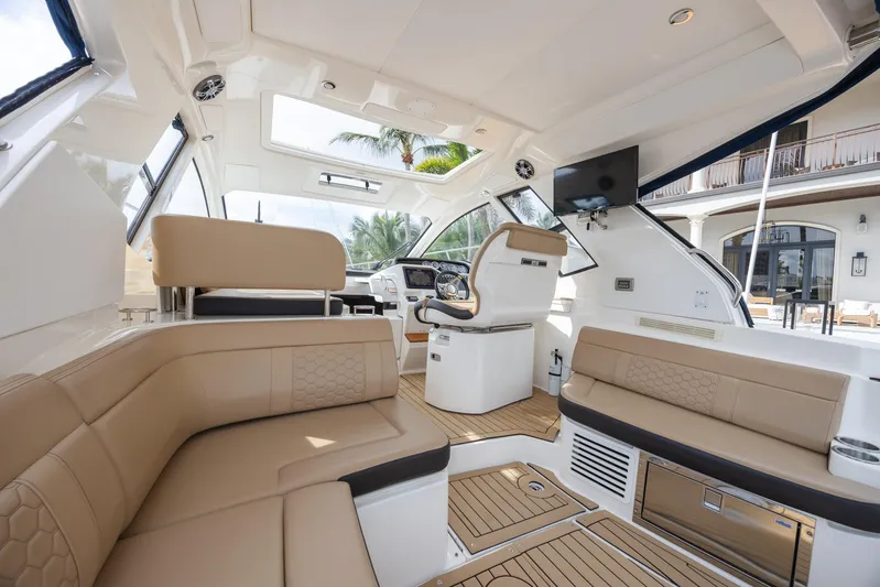  Yacht Photos Pics Interior of 2019 Sea Ray Sundancer 350 Coupe with luxurious seating and modern helm.