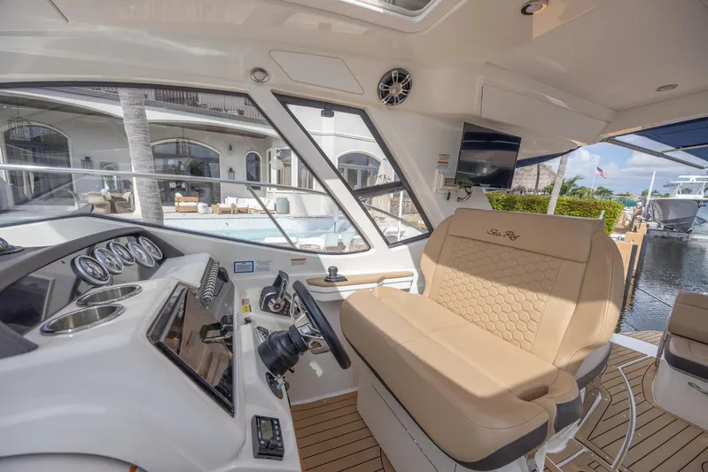  Yacht Photos Pics Interior of 2019 Sea Ray Sundancer 350 Coupe with helm and seating area.