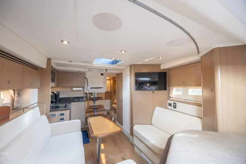  Yacht Photos Pics Interior of 2019 Sea Ray Sundancer 350 Coupe, featuring modern seating and entertainment area.
