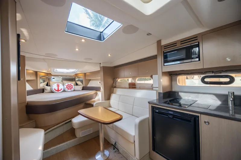  Yacht Photos Pics Luxurious interior of 2019 Sea Ray Sundancer 350 Coupe with modern amenities.