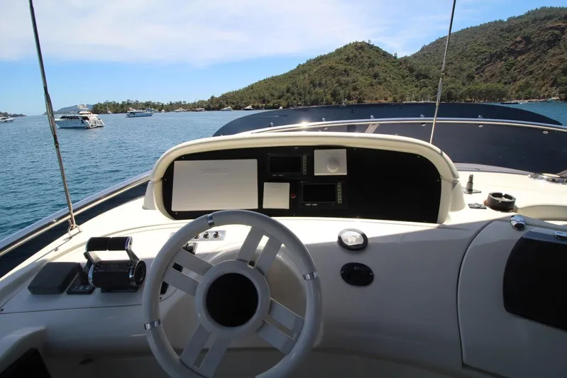  Yacht Photos Pics Cockpit view of 2007 Azimut 68 FLY yacht with scenic ocean backdrop.