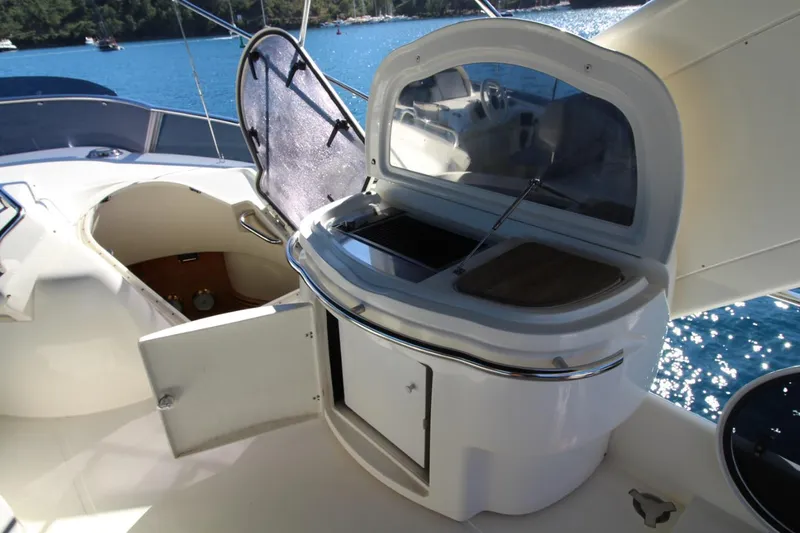  Yacht Photos Pics Luxurious 2007 Azimut 68 FLY yacht with outdoor kitchenette and scenic ocean view.