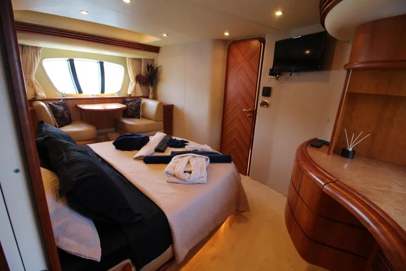  Yacht Photos Pics Luxurious interior of 2007 Azimut 68 FLY yacht with elegant bedroom and seating area.