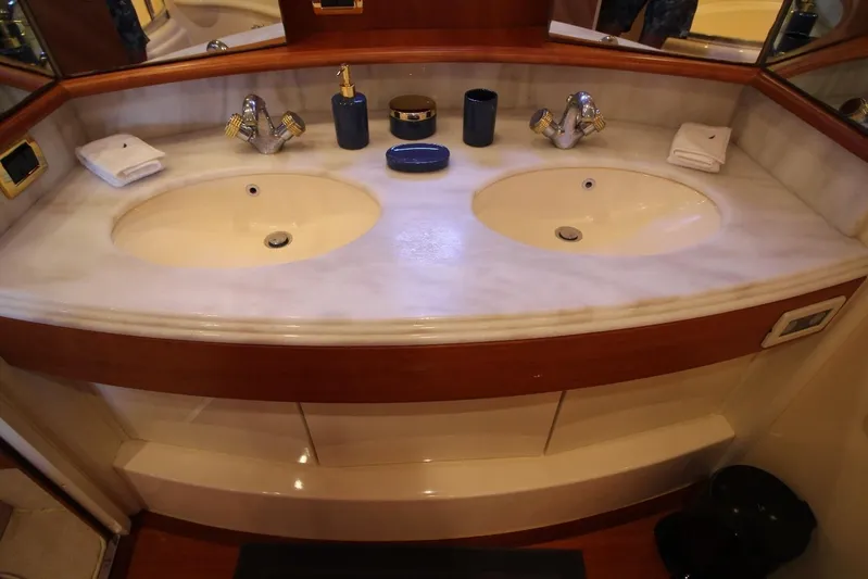  Yacht Photos Pics Luxury Azimut 68 FLY 2007 yacht bathroom with dual sinks and elegant fixtures.