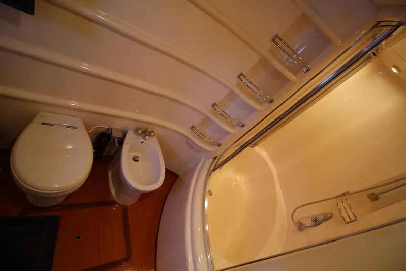  Yacht Photos Pics Luxurious bathroom in 2007 Azimut 68 FLY yacht with shower, toilet, and bidet.