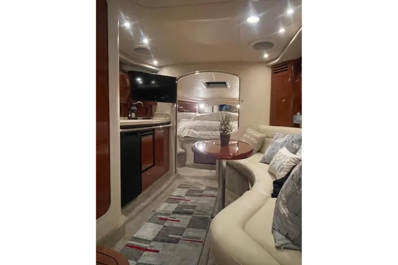  Yacht Photos Pics Luxurious interior of 2003 Sea Ray 360 Sundancer yacht with cozy seating and modern amenities.