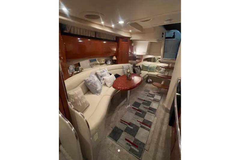  Yacht Photos Pics Luxurious interior of a 2003 Sea Ray 360 Sundancer yacht with elegant seating and decor.