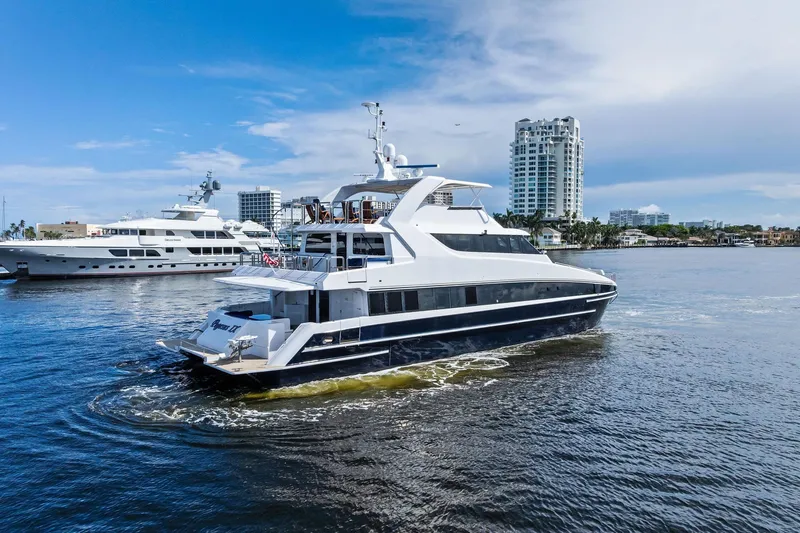 Pegasus Ix Yacht Photos Pics Luxurious 2004 Sabre 92 yacht cruising in a scenic waterfront setting.