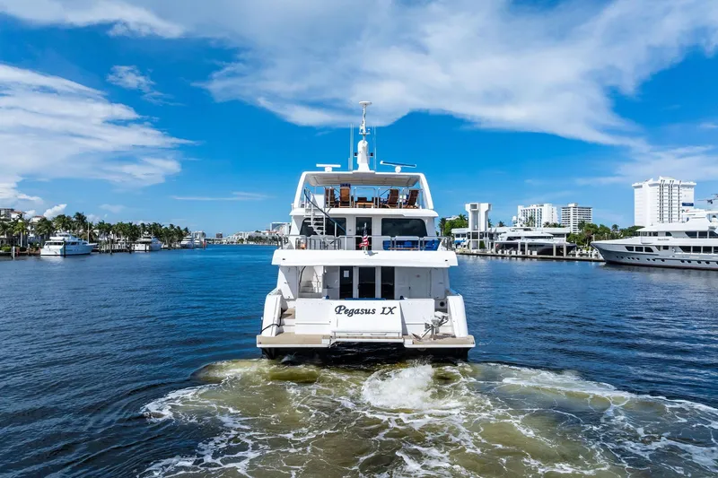 Pegasus Ix Yacht Photos Pics Luxury yacht "Pegasus IX" cruising in a sunny marina, Sabre 92, 2004 model.