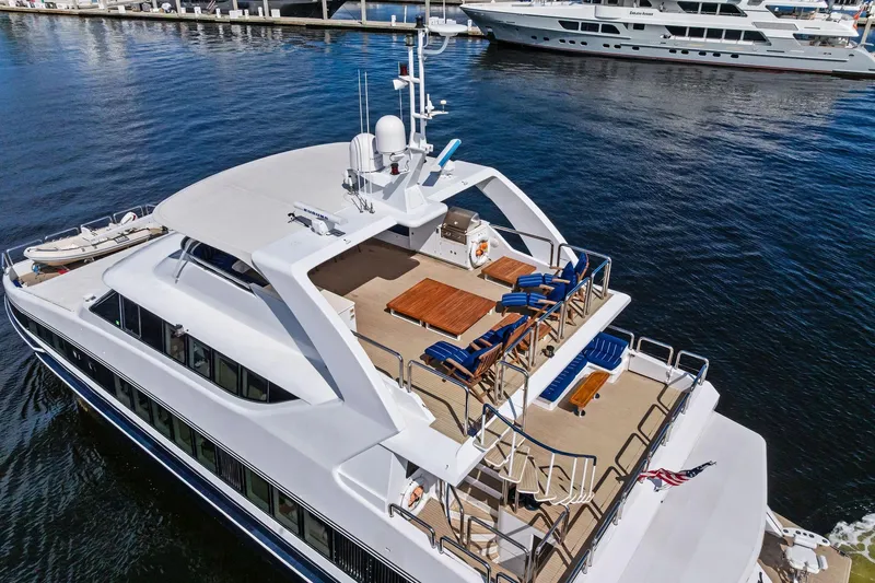 Pegasus Ix Yacht Photos Pics Luxurious 2004 Sabre 92 yacht with spacious deck and seating, docked in marina.