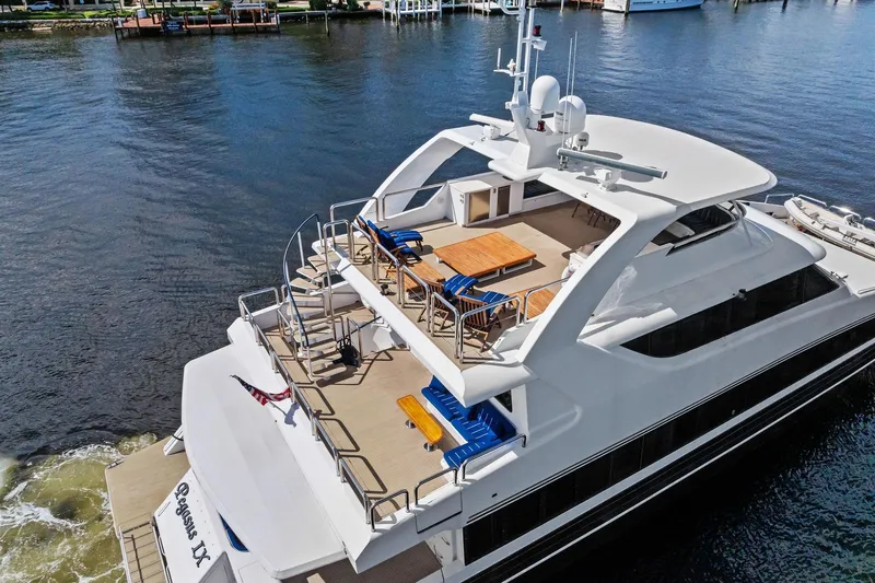 Pegasus Ix Yacht Photos Pics Luxurious 2004 Sabre 92 yacht with spacious deck and elegant seating on the water.