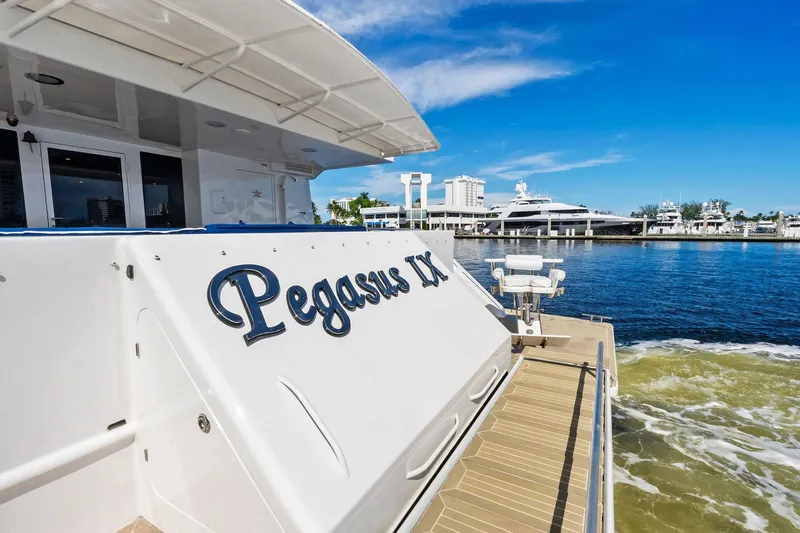 Pegasus Ix Yacht Photos Pics Luxury yacht "Pegasus IX" docked, featuring Sabre 92 model, 2004, under clear blue skies.