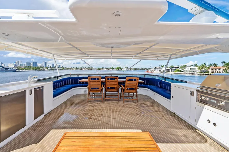 Pegasus Ix Yacht Photos Pics Luxurious 2004 Sabre 92 yacht deck with seating, dining area, and waterfront view.