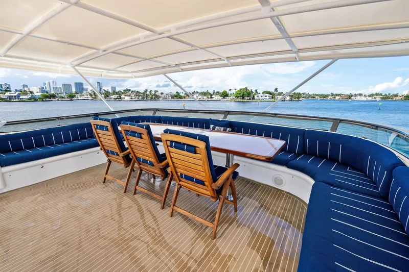 Pegasus Ix Yacht Photos Pics Luxurious 2004 Sabre 92 yacht deck with seating, overlooking scenic waterfront views.