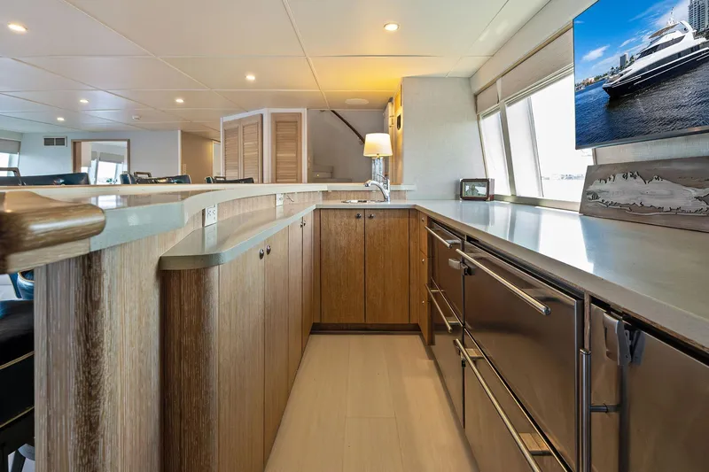 Pegasus Ix Yacht Photos Pics Luxurious 2004 Sabre 92 yacht interior with modern kitchen and elegant wood cabinetry.