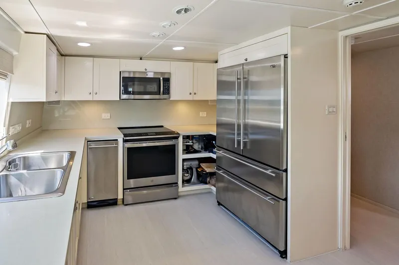 Pegasus Ix Yacht Photos Pics Modern kitchen in 2004 Sabre 92 yacht with stainless steel appliances and sleek cabinetry.