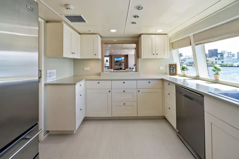 Pegasus Ix Yacht Photos Pics Modern kitchen interior on a 2004 Sabre 92 yacht, featuring sleek cabinetry and waterfront views.