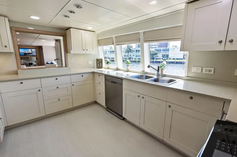 Pegasus Ix Yacht Photos Pics Luxurious kitchen interior on 2004 Sabre 92 yacht with modern cabinetry and waterfront view.