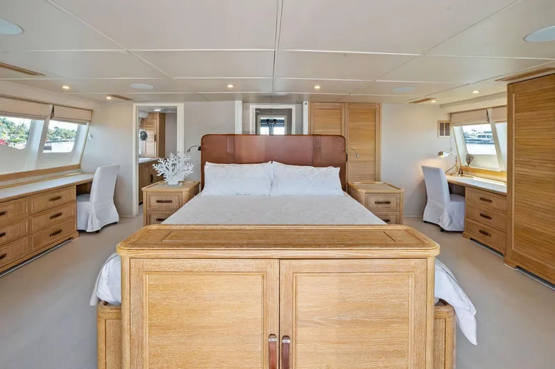Pegasus Ix Yacht Photos Pics Luxurious 2004 Sabre 92 yacht bedroom with elegant wood furnishings and large windows.
