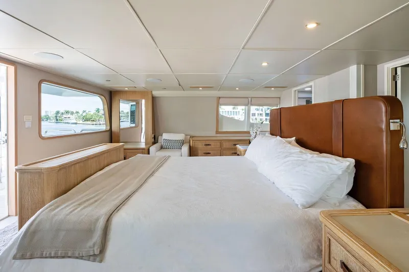 Pegasus Ix Yacht Photos Pics Luxurious bedroom interior on 2004 Sabre 92 yacht with large windows and elegant furnishings.