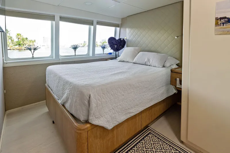 Pegasus Ix Yacht Photos Pics Luxurious bedroom interior on 2004 Sabre 92 yacht with waterfront view.