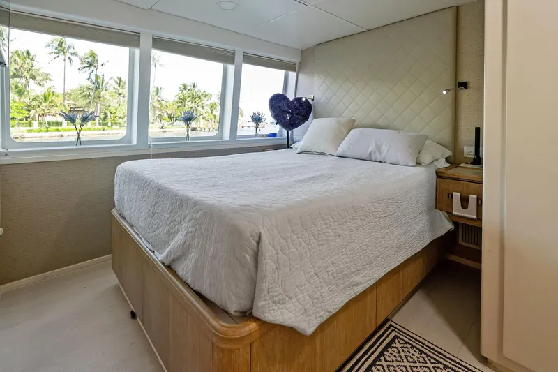 Pegasus Ix Yacht Photos Pics Luxurious bedroom interior on 2004 Sabre 92 yacht with large windows and elegant decor.