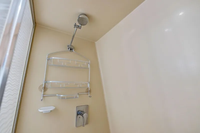 Pegasus Ix Yacht Photos Pics Shower interior with metal caddy and modern fixtures in Sabre 92, 2004 model.