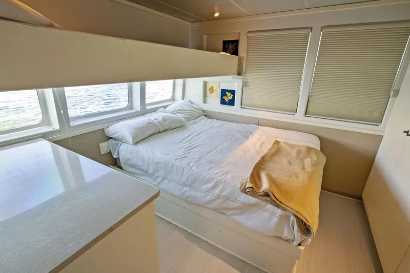 Pegasus Ix Yacht Photos Pics Cozy bedroom interior on 2004 Sabre 92 yacht with ocean view windows.
