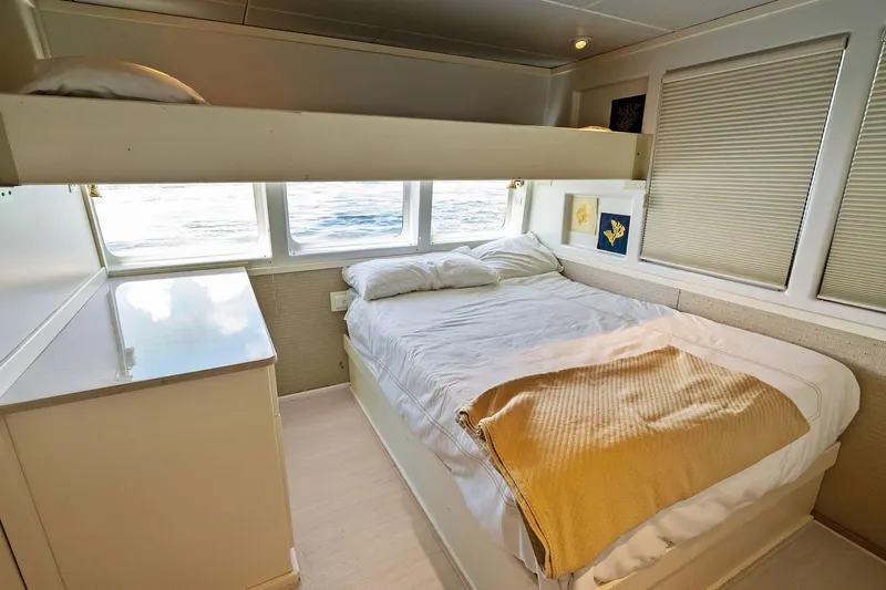Pegasus Ix Yacht Photos Pics Cozy bedroom in 2004 Sabre 92 yacht with ocean view and modern decor.