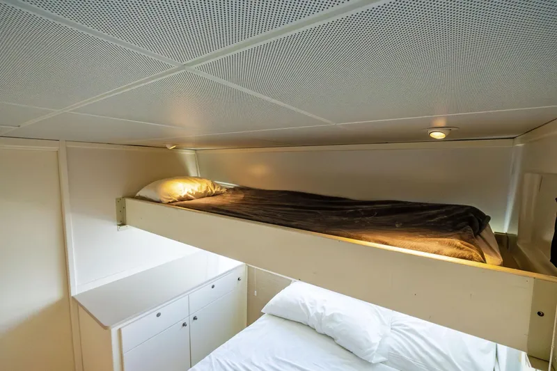 Pegasus Ix Yacht Photos Pics Bunk beds in a 2004 Sabre 92 yacht cabin with modern lighting.