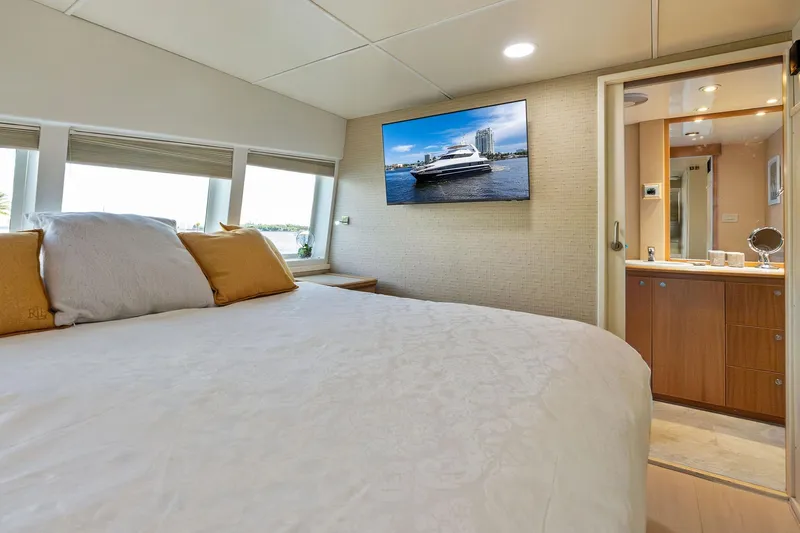 Pegasus Ix Yacht Photos Pics Luxurious bedroom interior of 2004 Sabre 92 yacht with modern amenities and elegant decor.