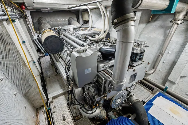 Pegasus Ix Yacht Photos Pics Engine room of a 2004 Sabre 92 yacht, showcasing complex machinery and piping.